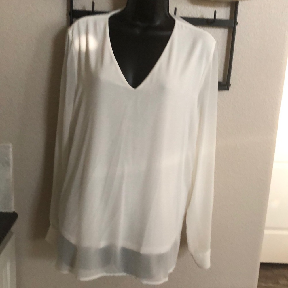 White sheer blouse with lining.